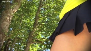 She is caught without panties in a short skirt in the Park. Up skirt close up