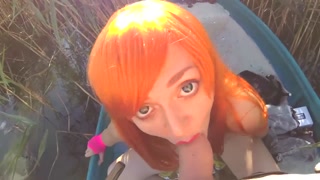 Redhead gives a on a boat