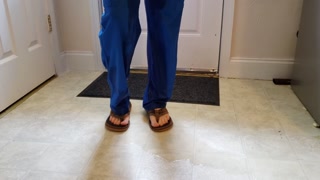 Nurse wetting her scrubs