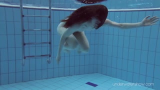 Roxalana submerged in the pool naked