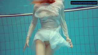 Redhead Diana hot and horny in a white dress