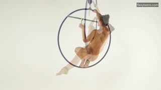 Brunette Kim Nadara in yellow socks doing acrobatics