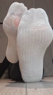Dirty white socks with a peep-hole😍 Enjoy the show so I do too.