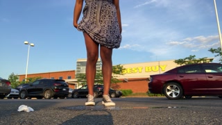 Peeing at crowded Best Buy parking lot.