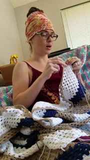Creature crocheting and singing a tune